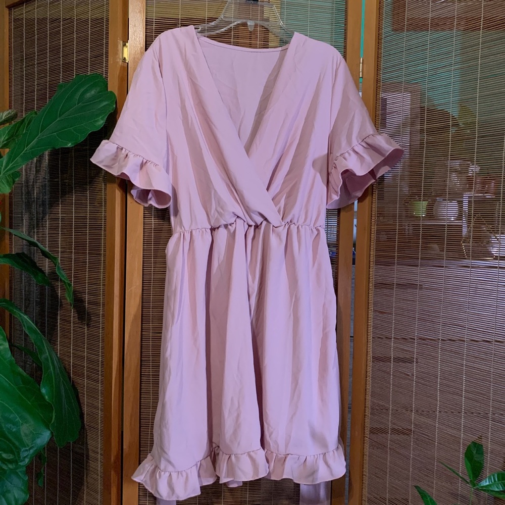 Soft pink dress with ruffled sleeves. No tag but is a small and has a tie